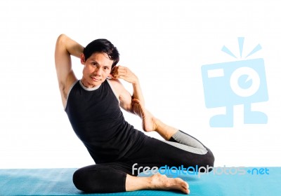 Man Doing Yoga Stock Photo