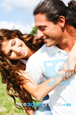 Man Giving Piggyback Ride Stock Photo