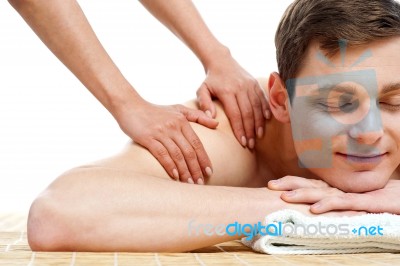 Man Having Massage In A Spa Center Stock Photo