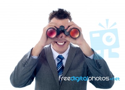 Man Looking Through Binoculars Stock Photo
