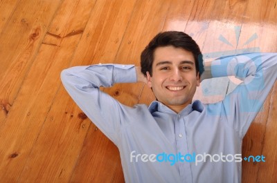 Man Lying On The Floor Stock Photo