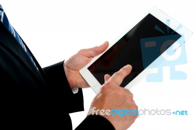 Man Operating Touch Screen Device, Focus On Tablet Stock Photo