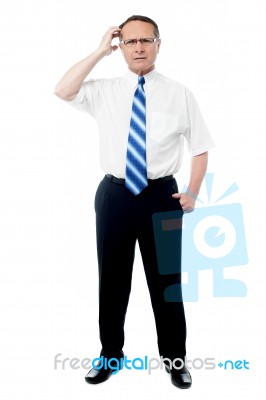 Man Posing Against A White Background Stock Photo