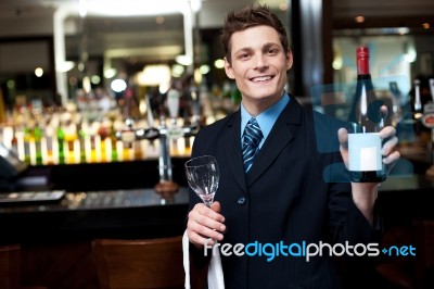Man Posing With A Bottle Of Wine Stock Photo