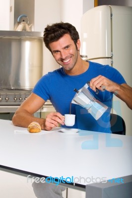 Man Pouring Coffee Stock Photo