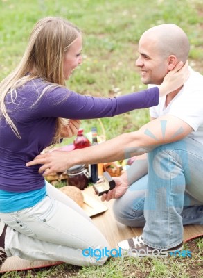 Man Presenting A Gift To His Girlfriend Stock Photo