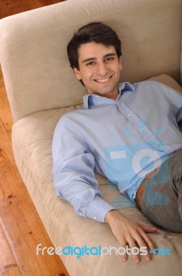 Man Relaxing On The Couch Stock Photo