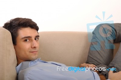 Man Relaxing On The Couch Stock Photo