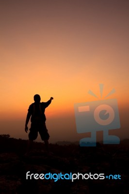 Man Silhouette On The Sunset Stock Photo