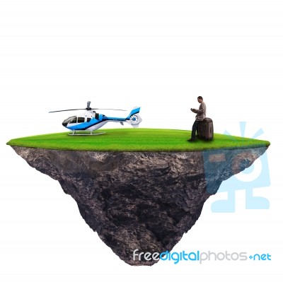 Man Standing With Helicopter On Green Grass Stock Photo