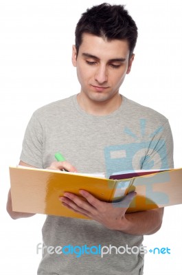 Man Studying With Dossier Stock Photo