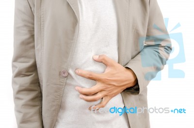 Man Suffering From Abdominal Pain Stock Photo