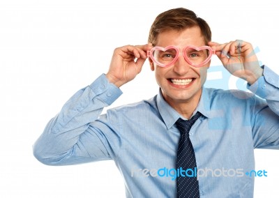 Man Wearing Heart Shaped Eyeglass Stock Photo