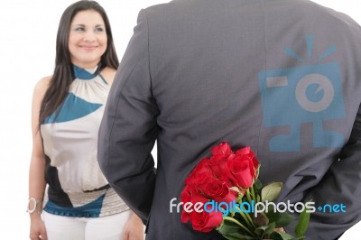 Man With A Bouquet Of Red Roses Watching His Woman Isolated, Val… Stock Photo