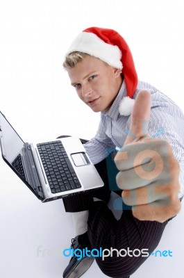 Man With Christmashat And Laptop Stock Photo