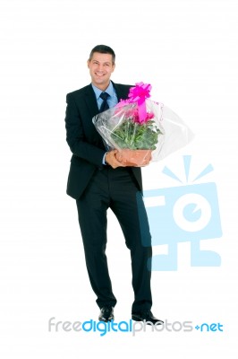 Man With Flowers Stock Photo