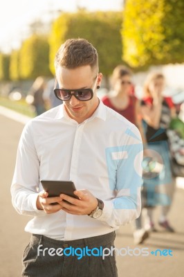 Man With Mobile Phone In Hands Stock Photo