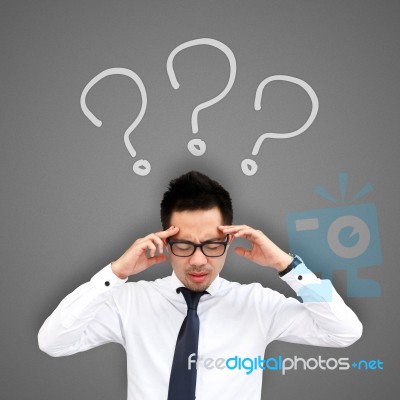 Man With Question Marks Over His Head Stock Photo