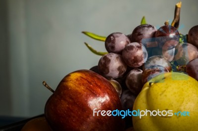 Many Fruits In A Tray On The Table Stock Photo