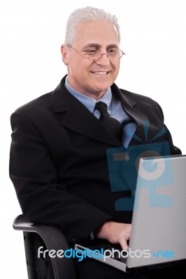 Mature Business Man In Working With Laptop Stock Photo