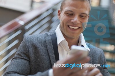 Men Read Sms On His Smartphone In Business Building Stock Photo