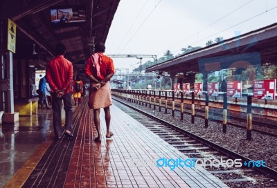 Men Walking Through A Railway Station In India Stock Photo