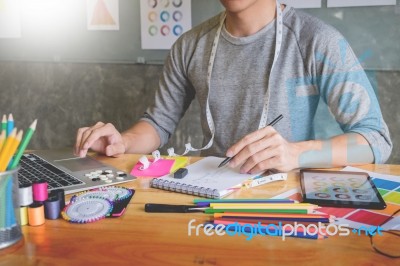 Men Working As Fashion Designer Drawing Sketches For Clothes