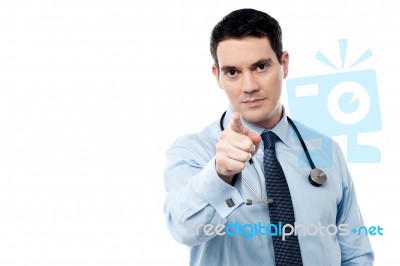 Middle Aged Doctor Pointing At Camera Stock Photo