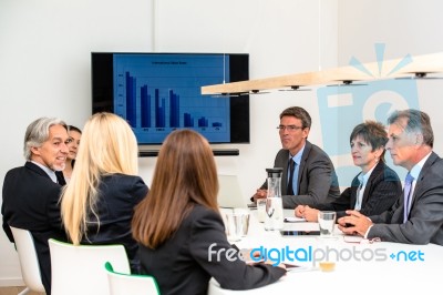 Mixed Group In Business Meeting Stock Photo