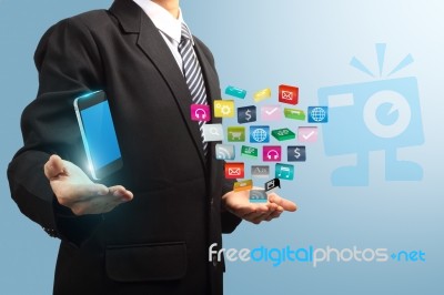 Mobile Phone With Applications Icon In The Hands Of Businessmen Stock Image