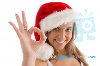 Model With Christmas Hat And Showing Ok Sign Stock Photo