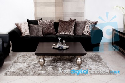 Modern Black Coloured Fabric Couch Stock Photo