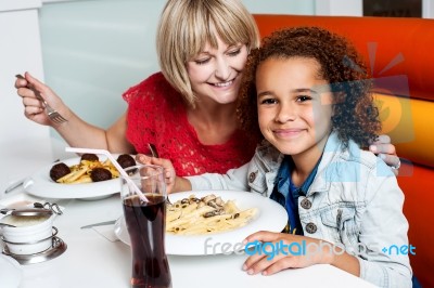 Mother And Daughter In A Restaurant Stock Photo