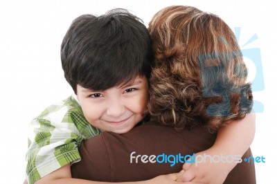Mother Carrying Young Son Stock Photo