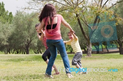 Mother Playing With Children Stock Photo