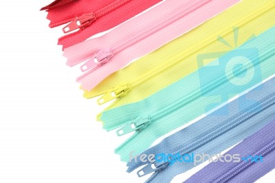 Multiple Row Of Zippers On White Background Stock Photo