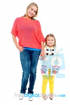 Mum And Daughter Posing In Trendy Outfits Stock Photo