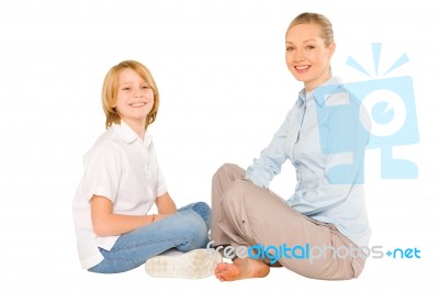 Mum And Son Sat On The Floor Smiling Isolated On White Backgroun… Stock Photo