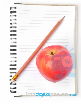 Notebook And Apple Isolated Stock Photo