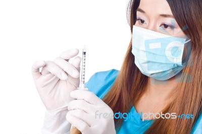 Nurse  Holding Syringe Stock Photo
