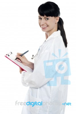 Nurse Writing Fresh Prescription For The Patient Stock Photo