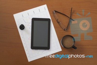 Offee On Worktable Covered With Documents Close Up Stock Photo