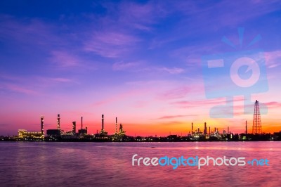 Oil Refinery Against Beautiful Sunrise Stock Photo