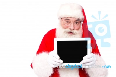 Old Cute Santa Shoeing Tablet Pc Stock Photo