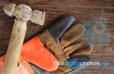 Old Hammer And Leather Gloves Stock Photo