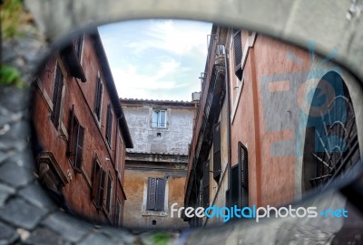 Old Italian Architecture Reflected In A Motorcycle Mirror Stock Photo