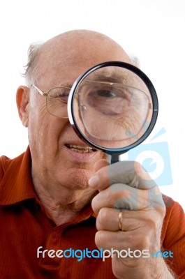 Old Man Looking Through Lens Stock Photo