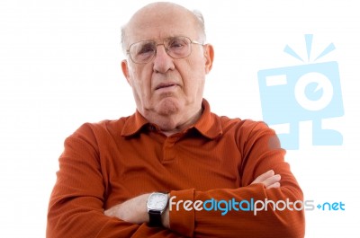 Old Man With Arms Crossed Stock Photo