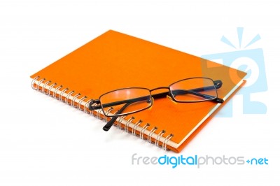 Orange Notebook And Sunglasses Stock Photo