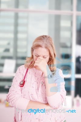 Overburdened Doctor At The Hospital Stock Photo